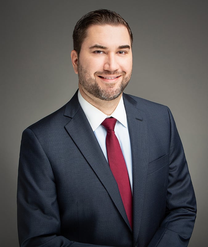 Headshot of attorney Justin T. Surginer